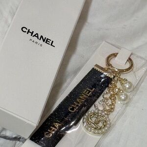 CHANEL authentic Black and Gold Keychain with Pearls